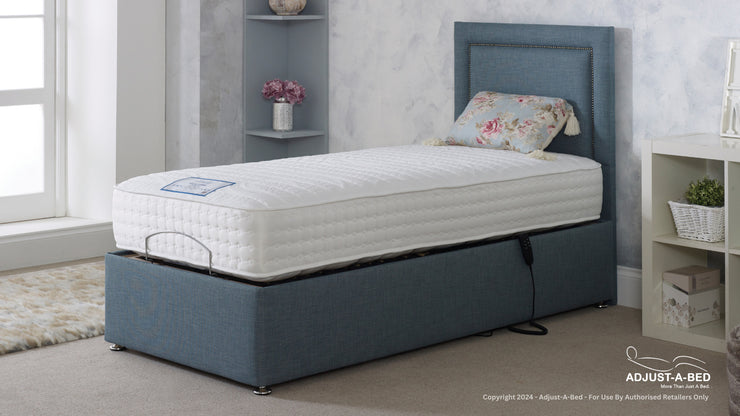 A blue adjustable bed featuring a comfortable mattress on top, perfect for a cozy night's sleep.